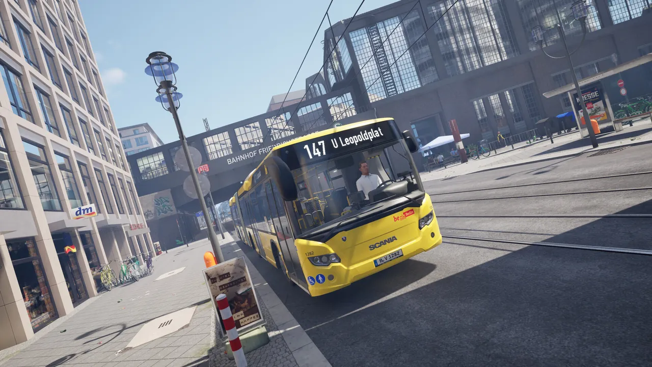 A city bus pulling into a stop in The Bus